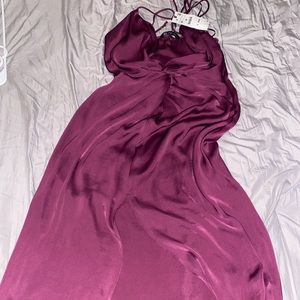 New V cut burgundy dress with open slit in the front of the dress